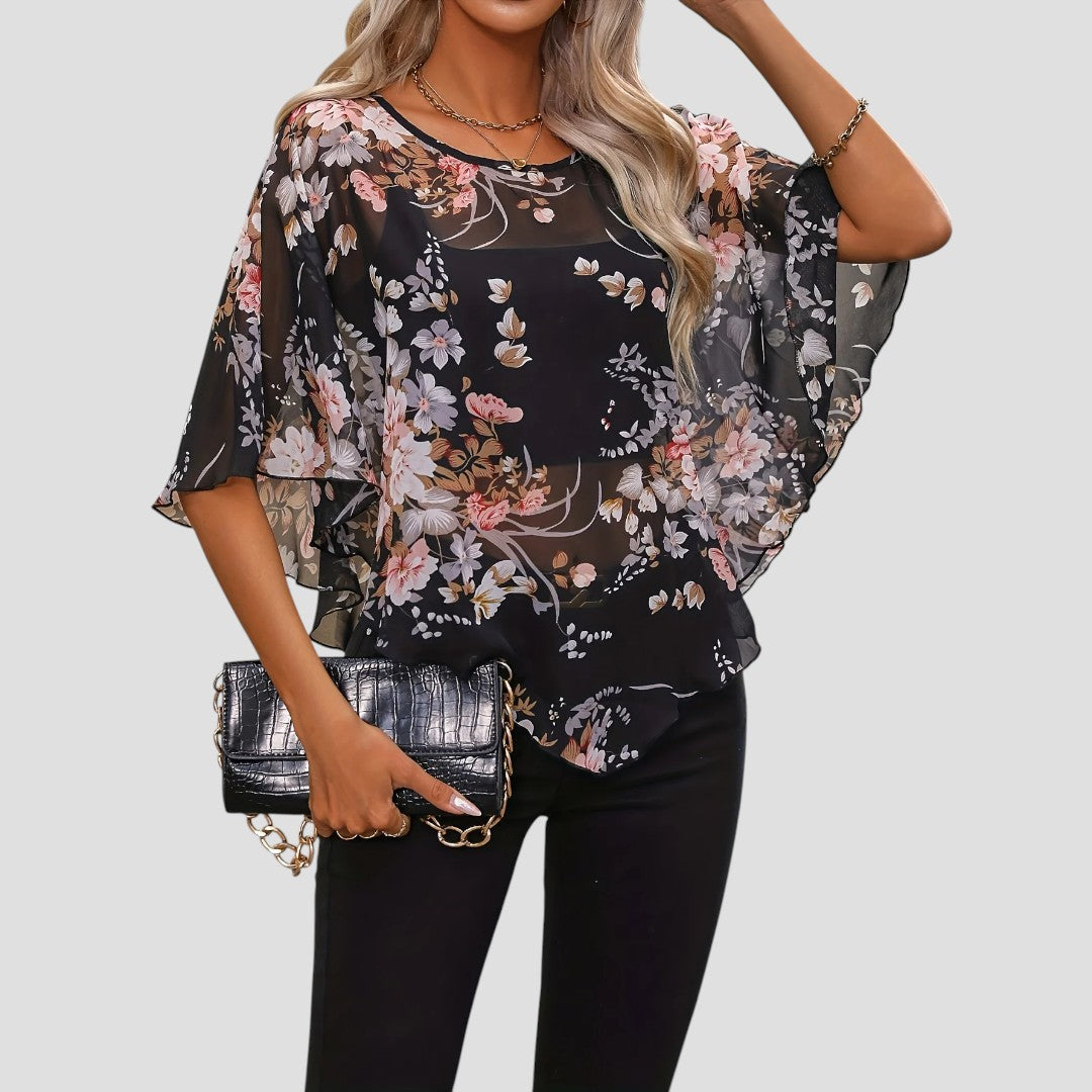 Chiara – Blusa Floreale Asimmetrica con Girocollo Elegante