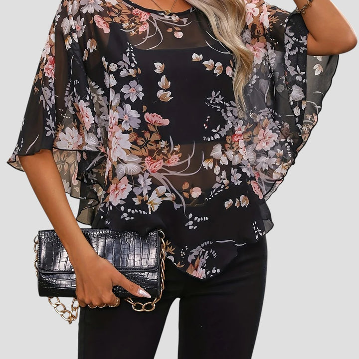 Chiara – Blusa Floreale Asimmetrica con Girocollo Elegante