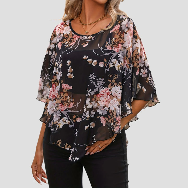 Chiara – Blusa Floreale Asimmetrica con Girocollo Elegante